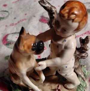 Charming Child and Dog Ceramic Figurine